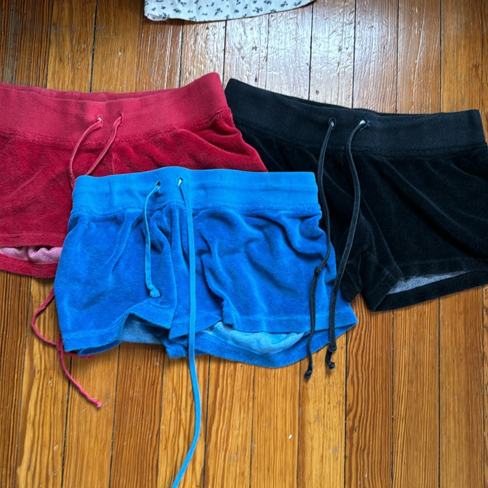3 pairs of hard tail shorts red blue black. Sized large and extra large kids!